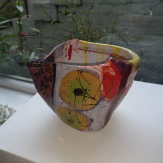colourful, decorative pot with butterflies and rabbits