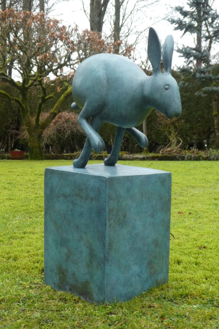 bronze sculpture of a hare running