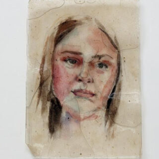 Head of a young woman with blonde hair