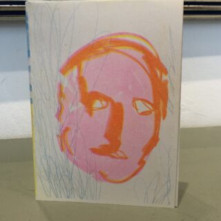 orange and pink drawing of a face on a blue background