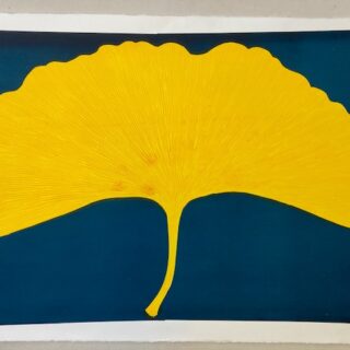 bright yellow leaf on a blue background