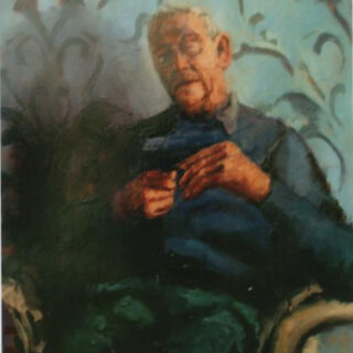 man with a green scarf on his knees